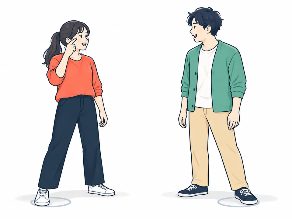 目元を指さして目線を確かめる女性と、となりに立つ男性